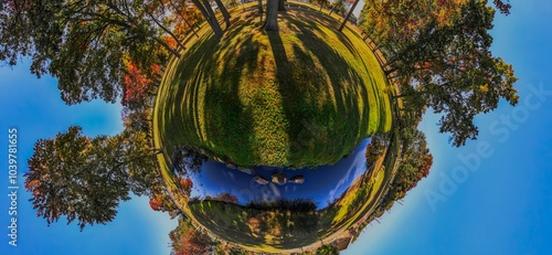 Schilderij op canvas Panoramic park in little planet effect with autumn colors.