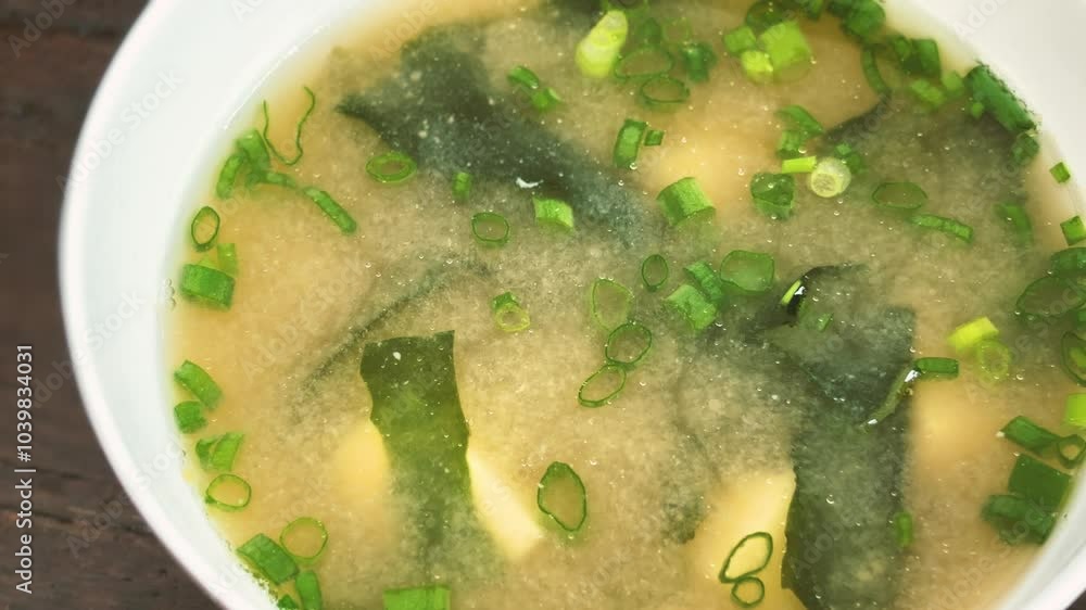 Close up a bowl of Miso soup, the healthy Soup Miso of Japanese cuisine. Close up a bowl of Miso soup, the healthy Soup Miso of Japanese cuisine.