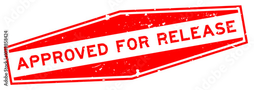 Grunge red approved for release word hexagon seal stamp on white background