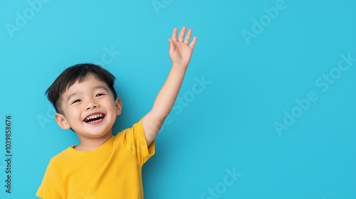 Asian boy raising hand