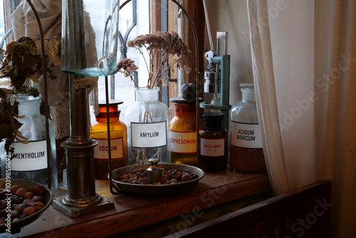 Old bottles with medications and chemicals substances in old pharmacy