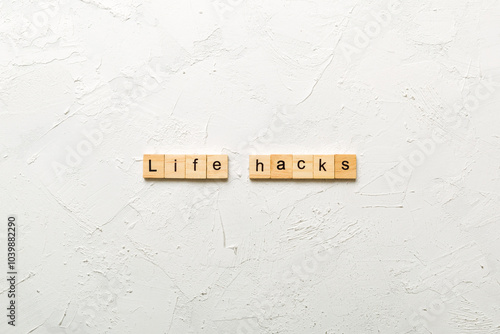 life hacks word written on wood block. life hacks text on table, concept