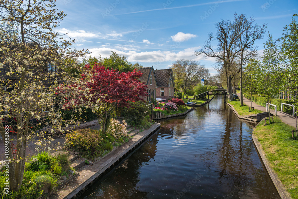 Giethoorn Netherlands, city skyline at canal and traditional house in Giethoorn village