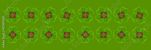 Vierblättriges Kleeblatt vor günem Hintergrund