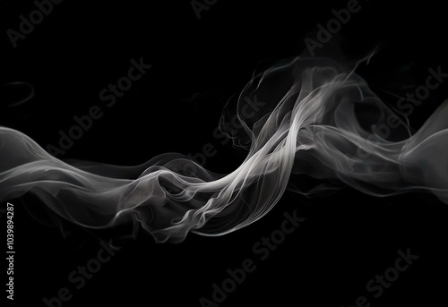 White smoke abstractly curves and flows on a black background.