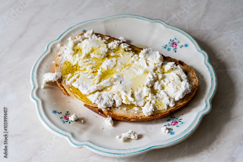 Turkish Lor Cheese with Olive Oil on Bread. photo