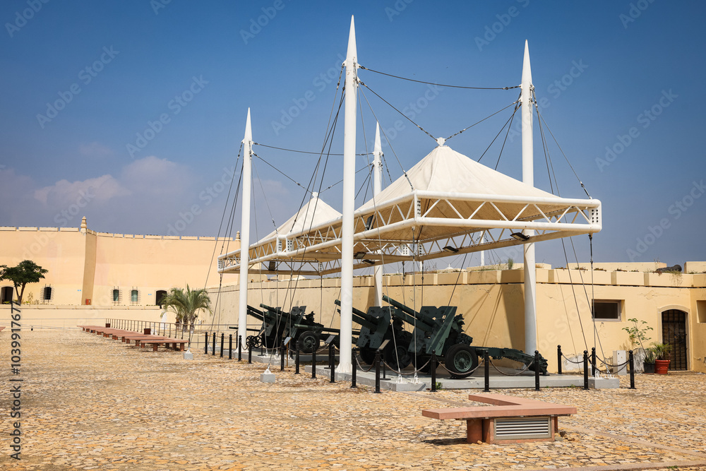 Obraz premium Exploring Fort San Miguel in Luanda an historic site featuring cannons and unique architecture under a clear blue sky