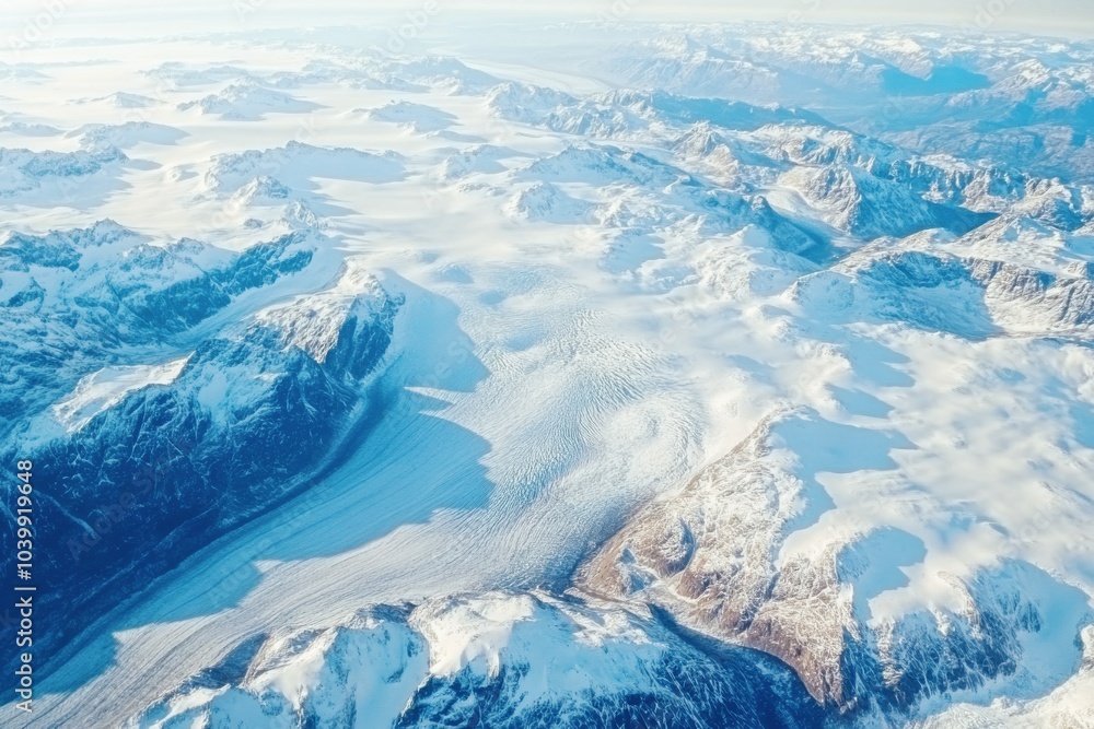 aerial view of vast snow-covered mountain range and expansive glacier landscape aerial view of vast snow-covered mountain range and expansive glacier landscape