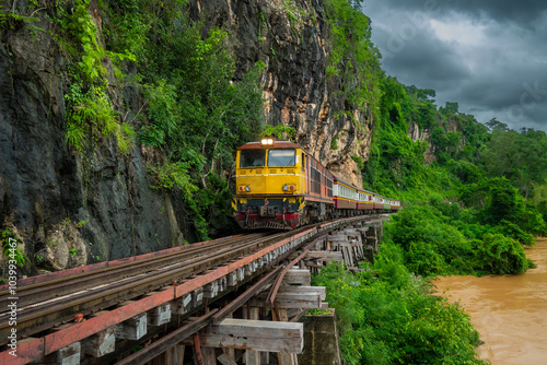 Canvastavla Trains running on death railways track crossing kwai river in kanchanaburi thail