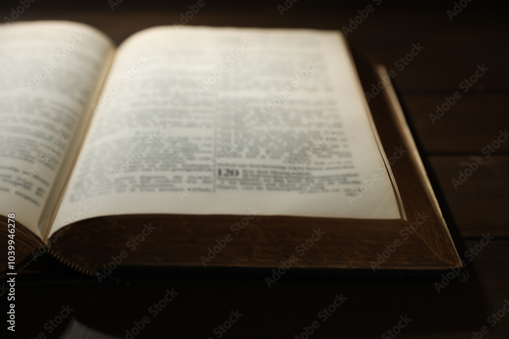 Obraz premium Open Bible on wooden table, closeup. Christian faith