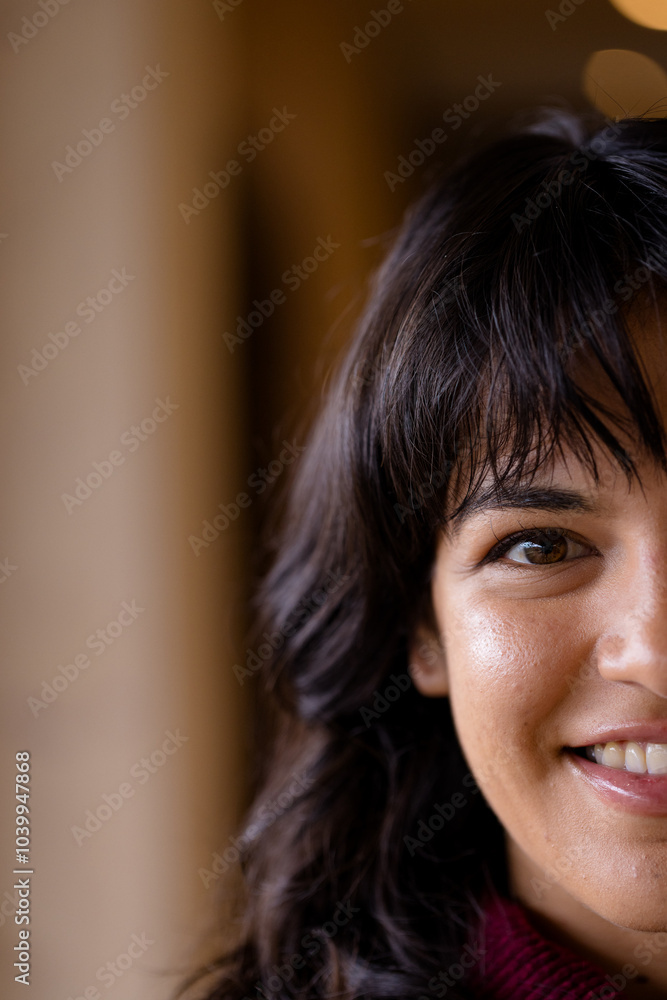 Smiling woman with dark hair enjoying cozy holiday atmosphere at home, copy space Smiling woman with dark hair enjoying cozy holiday atmosphere at home, copy space