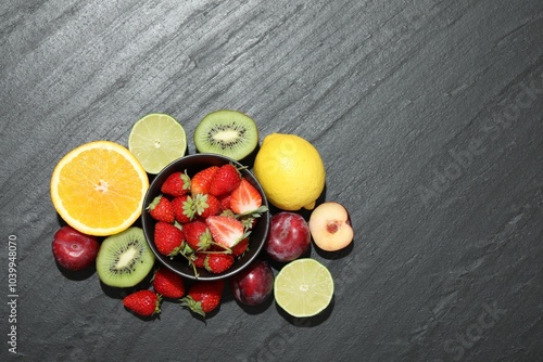 Different fresh fruits on grey textured table, flat lay. Space for text