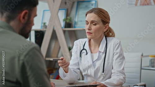 Woman practitioner explaining diagnosis during insurance appointment closeup.