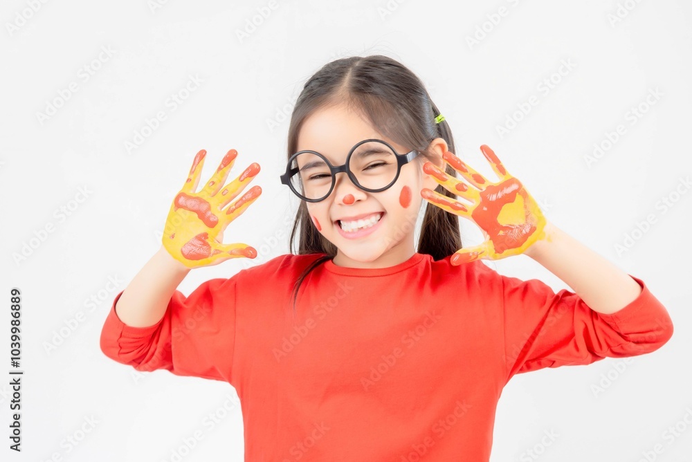 Little girl with hands painted in colorful paint. Little girl with hands painted in colorful paint.