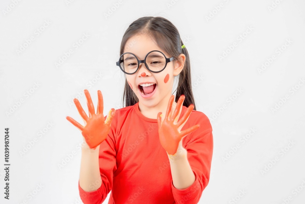 Little girl with hands painted in colorful paint. Little girl with hands painted in colorful paint.