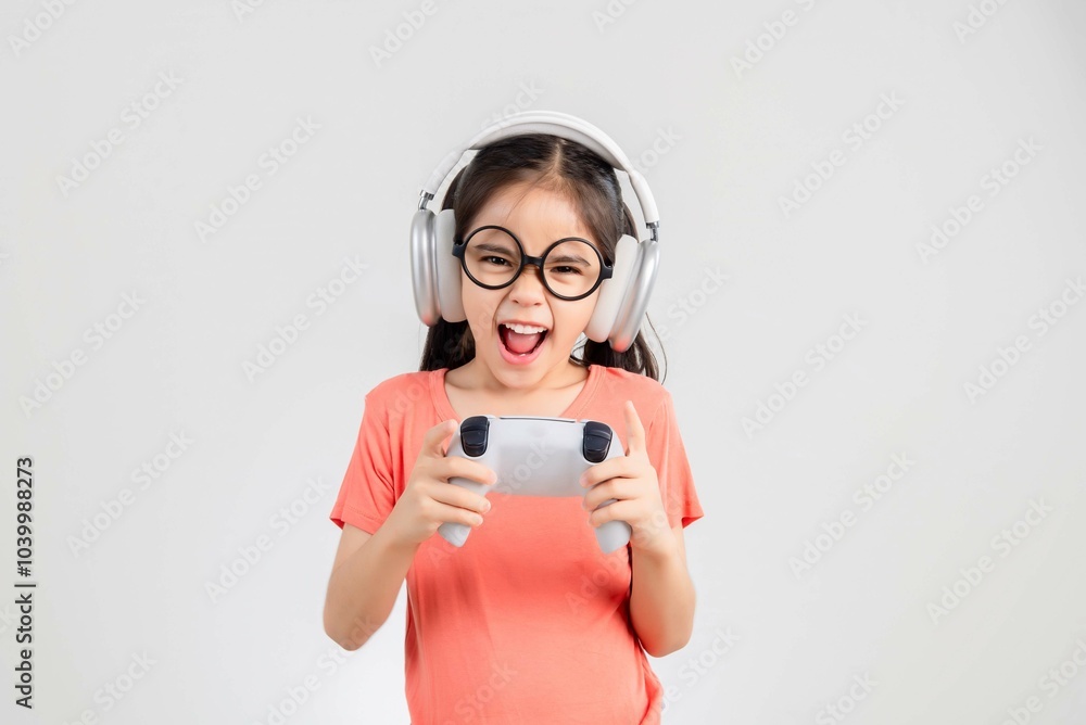 Asian happy portrait young kid girl smile lifestyle games technology holding joystick game playing on hands studio shot isolated white background with copy space. Asian happy portrait young kid girl smile lifestyle games technology holding joystick game playing on hands studio shot isolated white background with copy space.