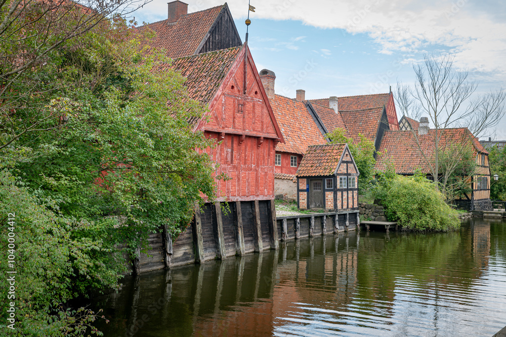 Obraz premium Historic Danish Timber-Framed Houses by Tranquil River in aalborg denmark