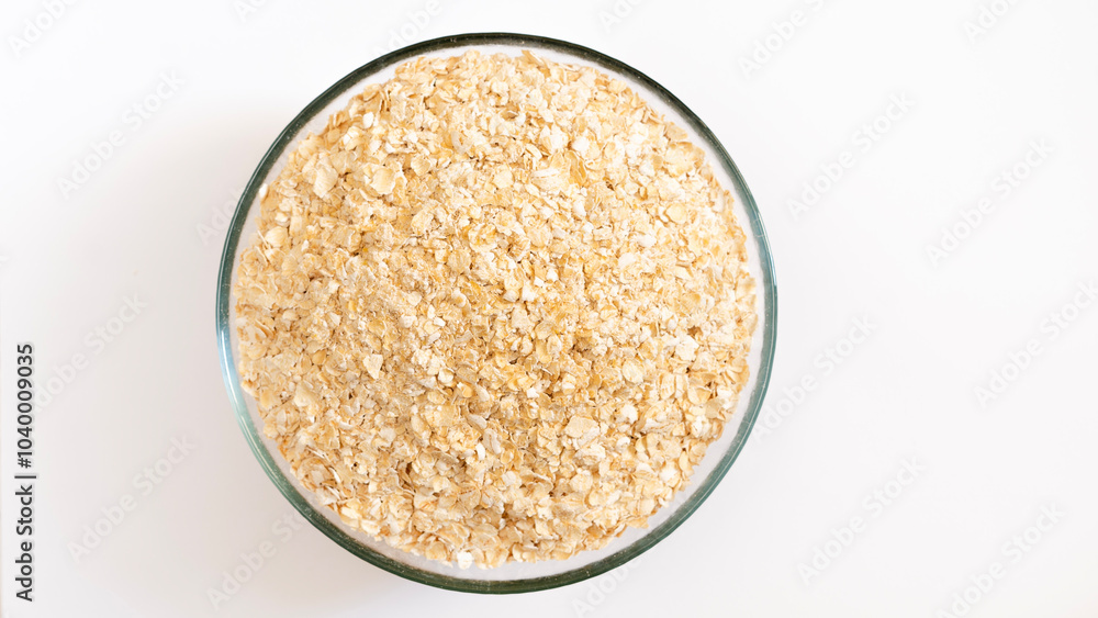 Oat flakes pile, cereal for breakfast isolated on white, top view Oat flakes pile, cereal for breakfast isolated on white, top view
