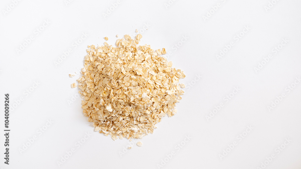 Oat flakes pile, cereal for breakfast isolated on white, top view Oat flakes pile, cereal for breakfast isolated on white, top view