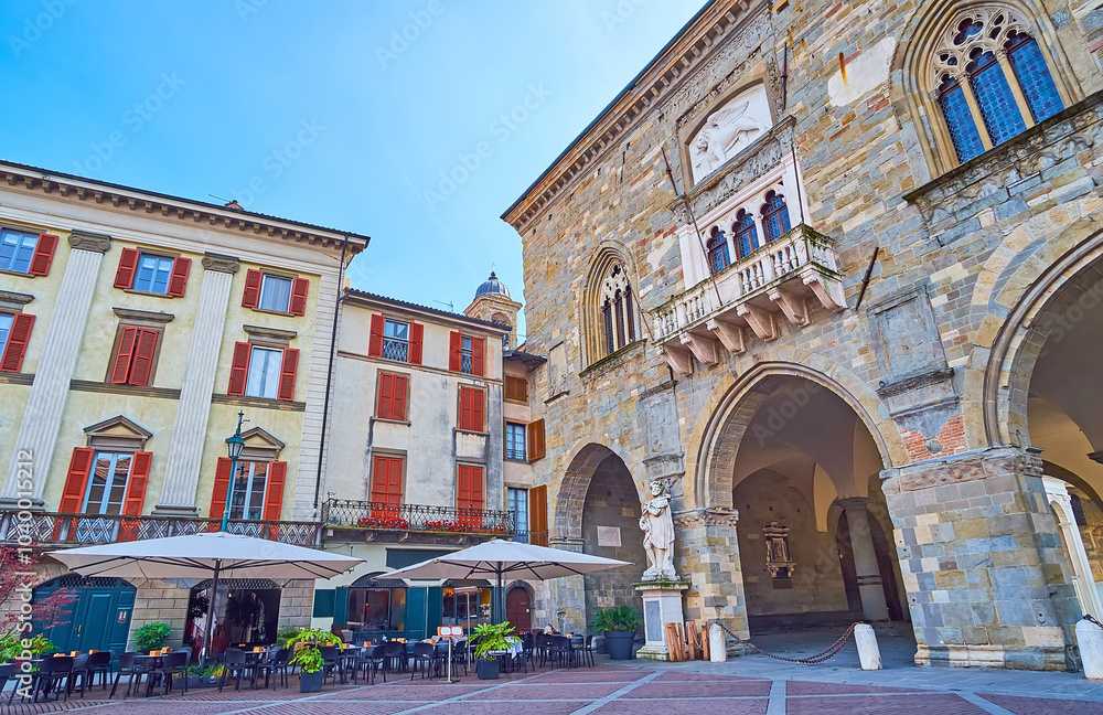 Torquato Tasso statue and Palazzo della Ragione, Piazza Vecchia, Bergamo, Italy