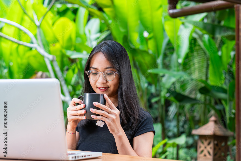 Woman Enjoying Coffee in a Lush Garden Woman Enjoying Coffee in a Lush Garden