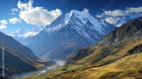 Majestic snow-capped mountains with a serene valley below.