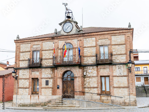 Madrid, Spain - October 14, 2024: Buildings surrounding the main square of the town of Peguerinos in the province of Avila, Spain photo