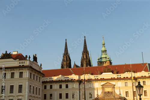 Enjoy the stunning views of the magnificent St. Vitus Cathedral towers against Pragues clear blue sky photo