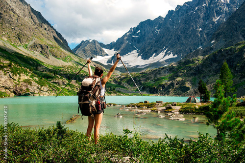 a tourist girl with a backpack on Lake Kuyguk in Altai photo