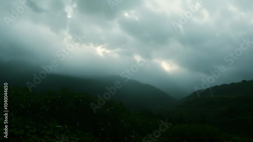 Timelapse. The scene starts at night and it's raining, and then it turns into A beautiful landscape with a bright sun shining through the clouds. And the rain stops. Timelapse in nature.