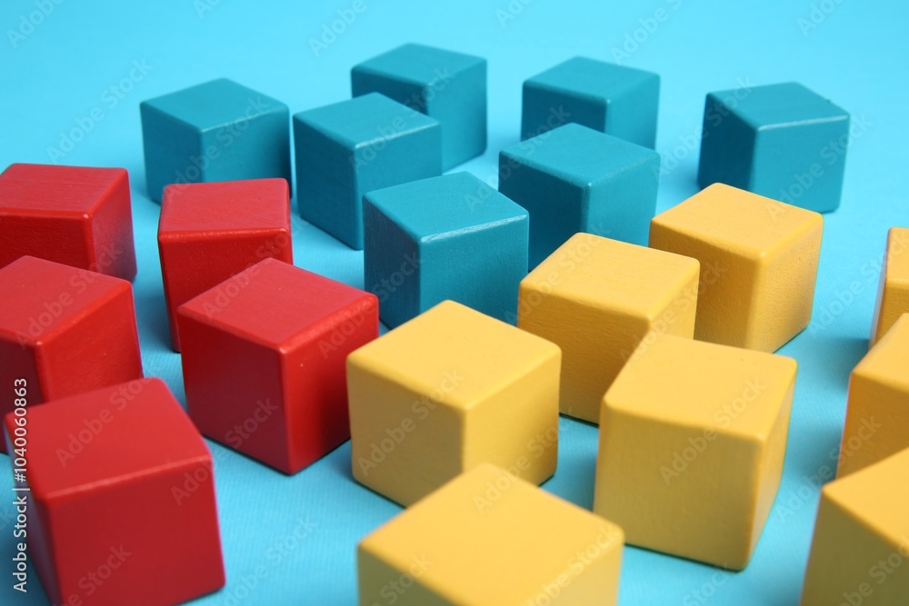 Many colorful cubes on light blue background Many colorful cubes on light blue background
