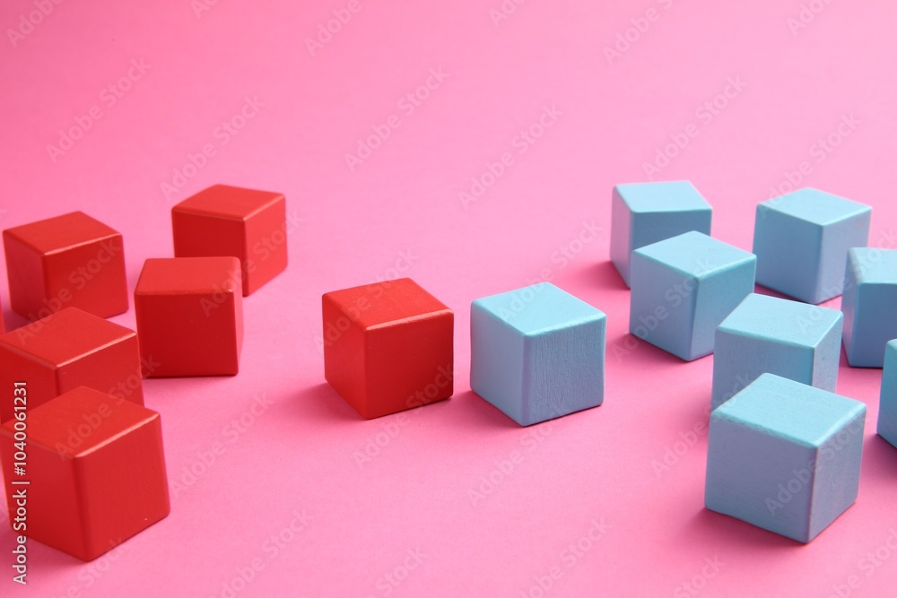 Many wooden colorful cubes on pink background Many wooden colorful cubes on pink background