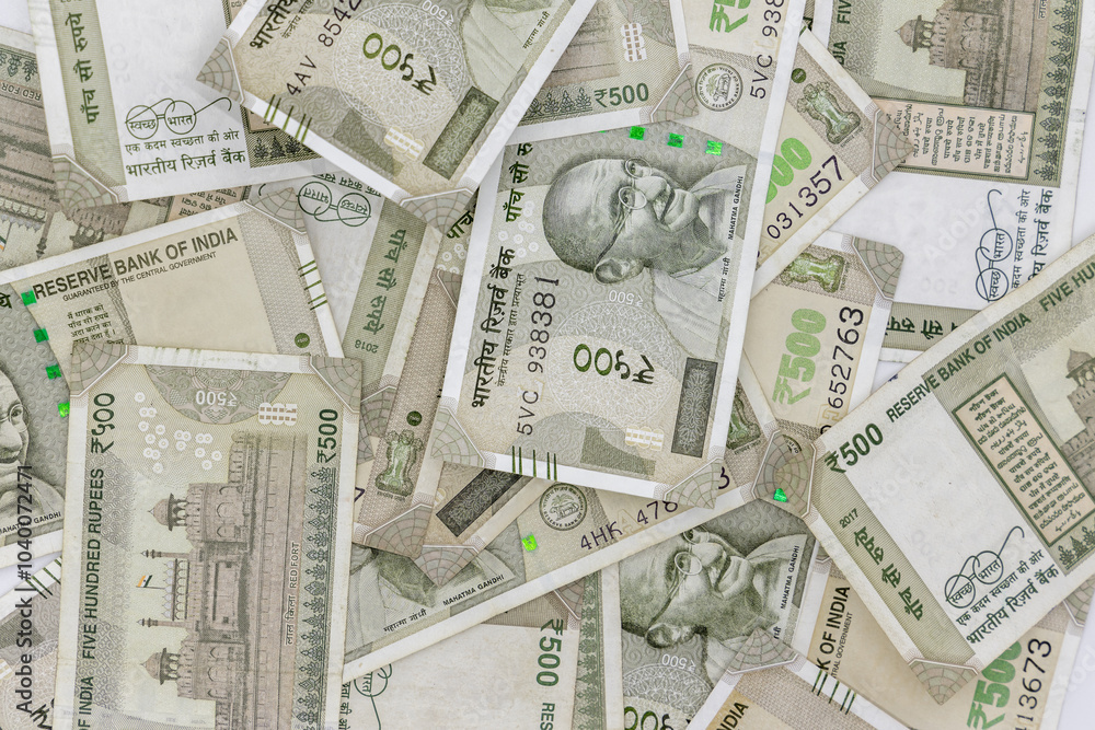 Indian currency 500 rupee bank note on white background, Five hundred Indian rupee bank paper currency note, Group of money stack of 500 Indian Rupee banknote.