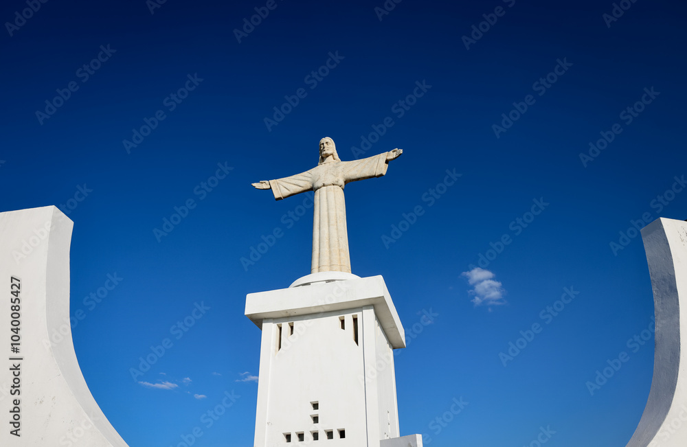 Christ the King statue in Lubango Angola stands tall against a clear blue sky symbolizing faith and hope for the local community Christ the King statue in Lubango Angola stands tall against a clear blue sky symbolizing faith and hope for the local community