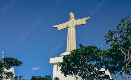 Christ the King statue overlooks Lubango Angola showcasing its impressive height against a clear blue sky photo