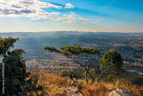 A panoramic view of Lubango Angola showcasing the landscape and urban life at sunset photo