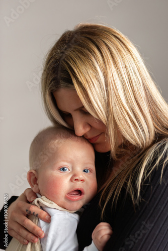 Aboriginal mum holding baby boy close photo