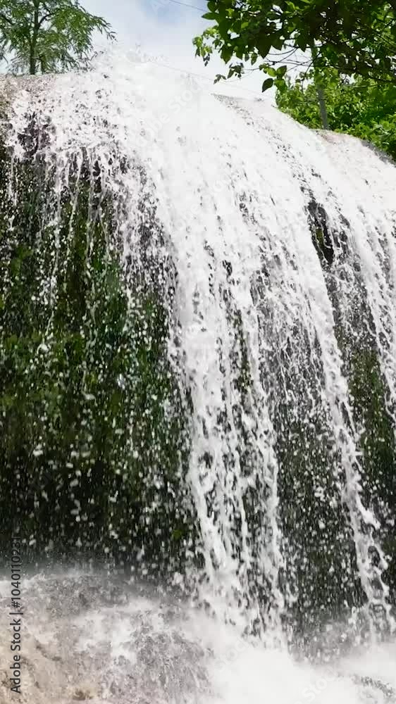 Waterfall in the rainforest. Tropical Lusno Falls in slow motion. Cebu, Philippines. Waterfall in the rainforest. Tropical Lusno Falls in slow motion. Cebu, Philippines.