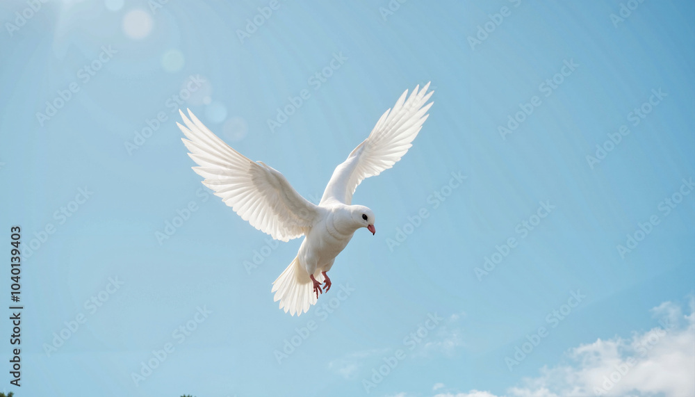Fototapeta premium White dove flying joyfully against a clear blue sky with a copy space 