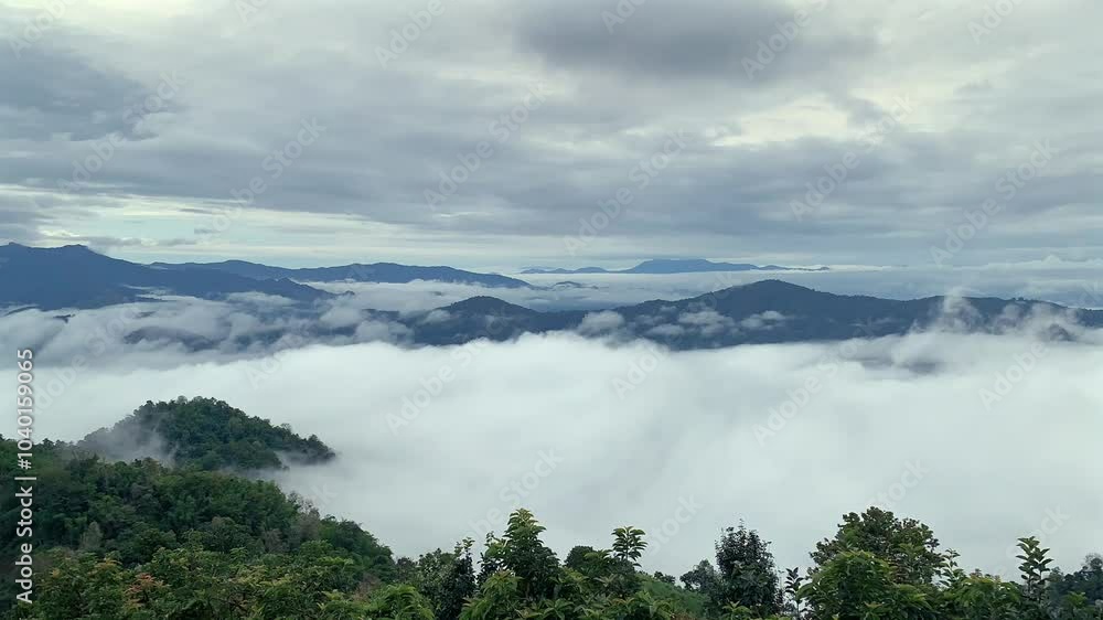 Time lapse of Morning fog over mountain and the forest of Doi Mon Ngo , located in Mae Taeng District, Chiang Mai Province. Thailand. Time lapse of Morning fog over mountain and the forest of Doi Mon Ngo , located in Mae Taeng District, Chiang Mai Province. Thailand.