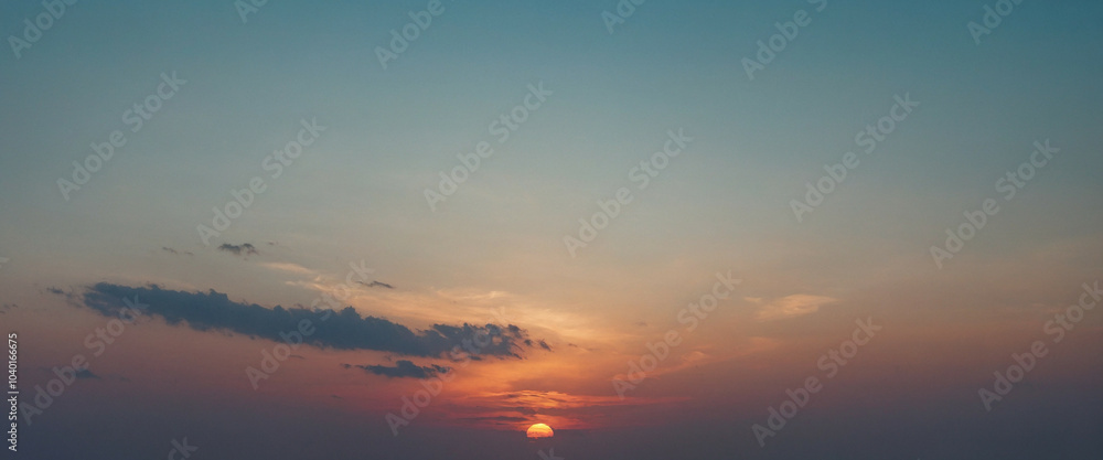 A serene sunset over the horizon with gradient colors lighting up the sky A serene sunset over the horizon with gradient colors lighting up the sky