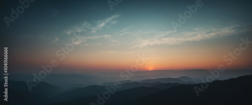 A serene sunrise over rolling hills, casting soft colors across the tranquil morning sky