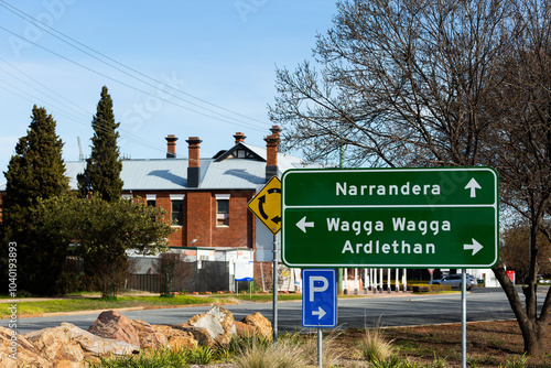 Green roadside sign with directions to Narrandera, Wagga and Ardlethan photo