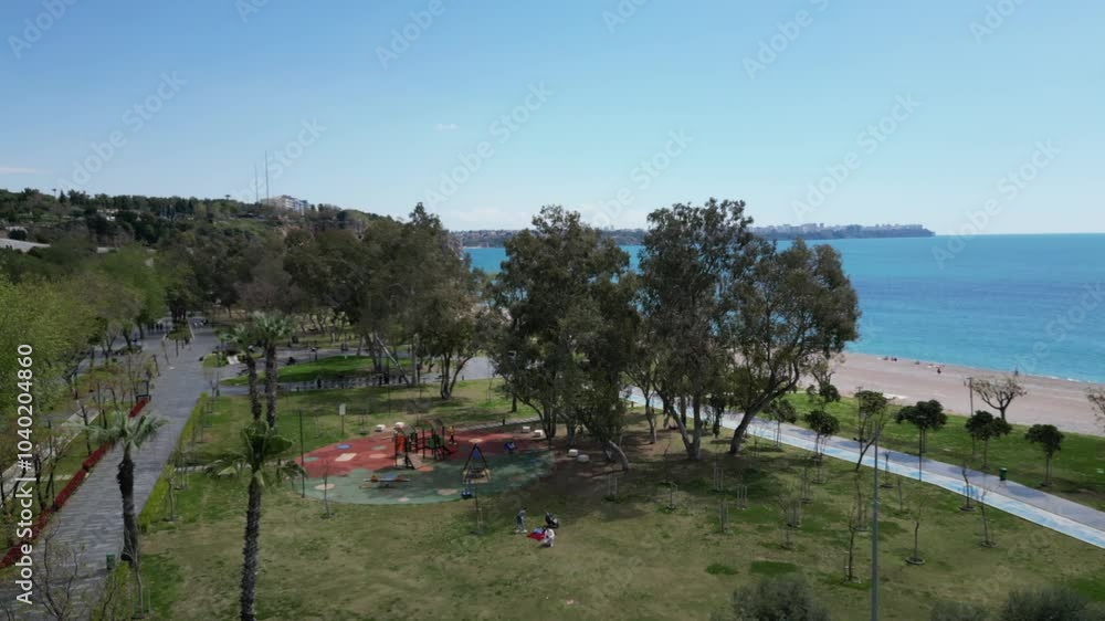 Breathtaking Scenic Coastal View Featuring Lush Greenery, Soft Sandy Beach, and Blue Ocean Breathtaking Scenic Coastal View Featuring Lush Greenery, Soft Sandy Beach, and Blue Ocean