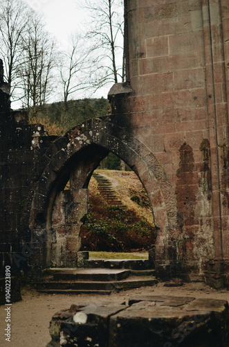 Gothic Ruin Arch Surrounded by Autumn Nature