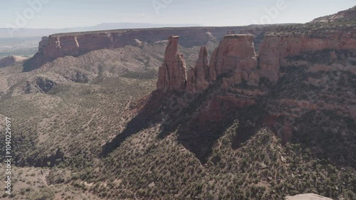 Colorado National Monument Park near the city of Grand Junction. Sheer-walled, Red rock canyons, Rim Rock Drive, Towering monoliths within a vast plateau and canyon panorama USA