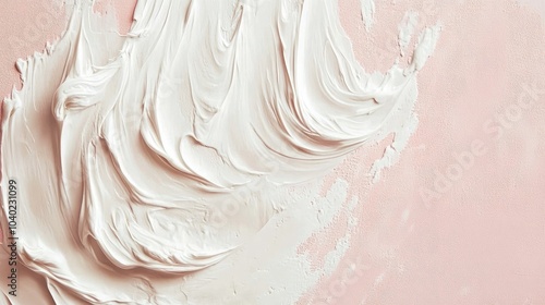 Smudge of white cream on a soft pink background, showing visible texture and swirl marks. The thick cream looks rich and smooth --chaos