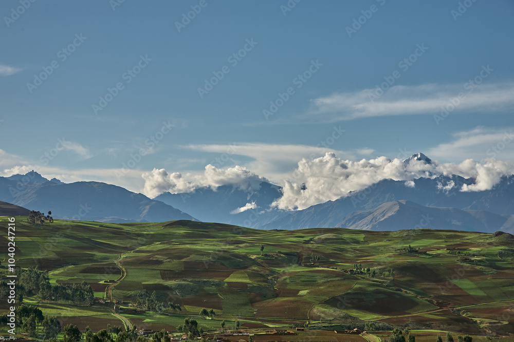 Fototapeta premium Endless beauty in the farmlands near Moray and Maras, where ancient techniques meet breathtaking landscapes. The heart of Peru’s agricultural history still thrives here.