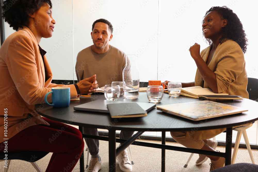 Diverse group of business people sitting in office Diverse group of business people sitting in office
