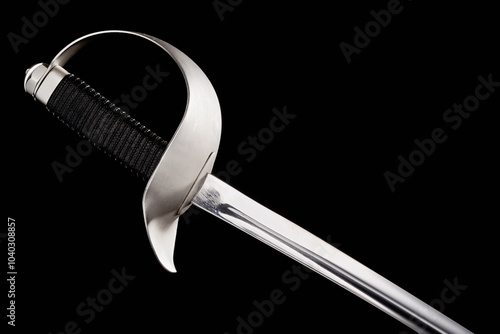 Old vintage sabre guard handle weapon on black background photo